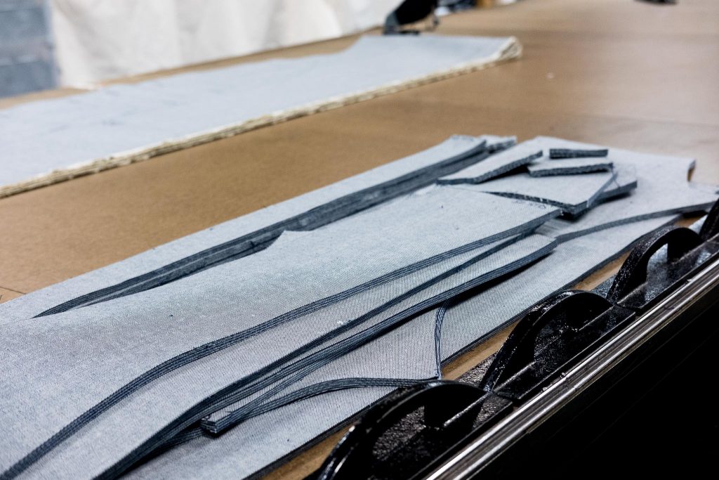 Shockoe Atelier cutting room floor with cut denim.