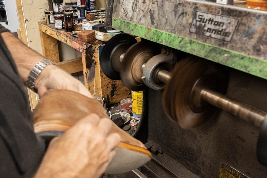 bedo's leatherworks the brushing station removes any remaining pieces or particulates or dust before applying a layer of cream polish