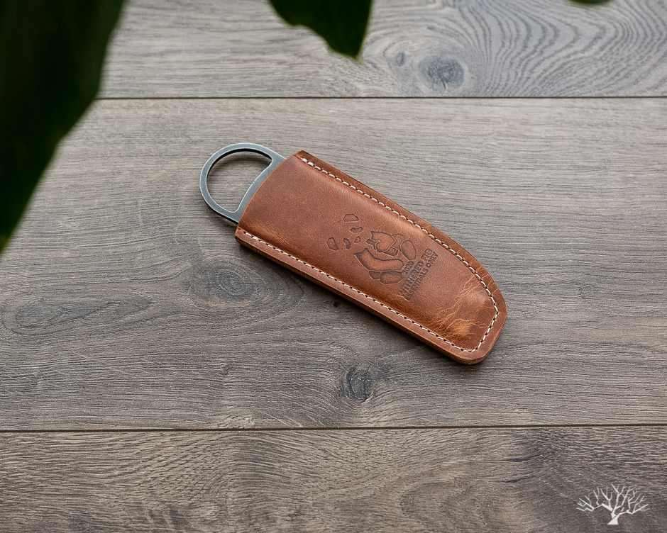 high side x withered fig wax cutter and bottle opener with horween natural dublin leather sheath