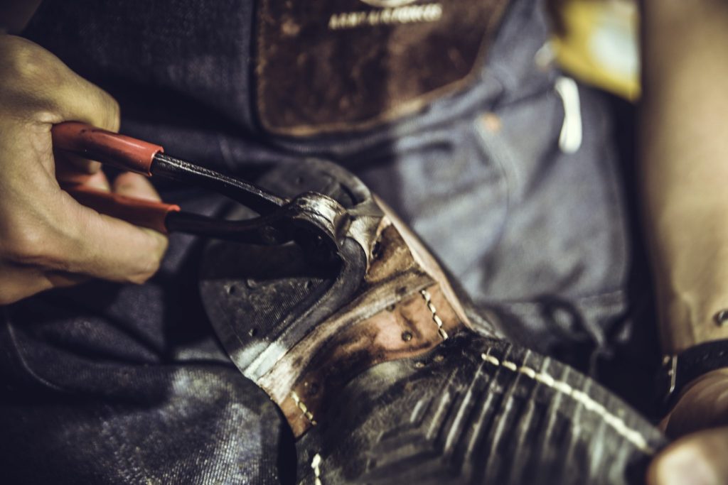 Working at shoe resole at Dr. Sole's Workshop